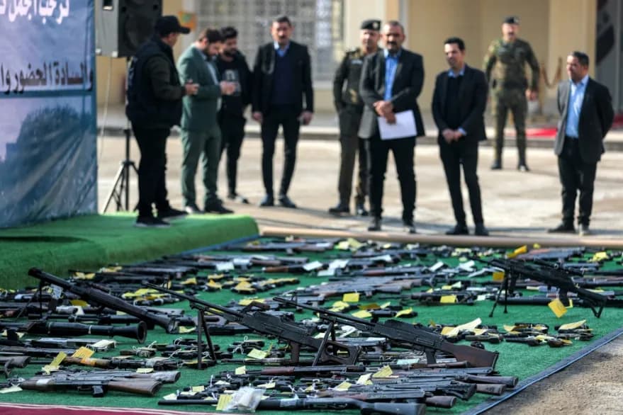 Unlicensed arms are displayed during an Iraqi security forces' exhibition of weapons they confiscated in Baghdad on December 23, 2024. File photo: AFP