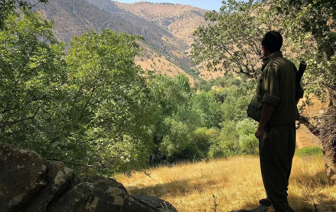 Rebwar Gholizadeh, nom de guerre Arivan Shoreshgir, looks out over the mountains of Sulaimani province in the summer of 2018. File photo: Fazel Hawramy / Rudaw