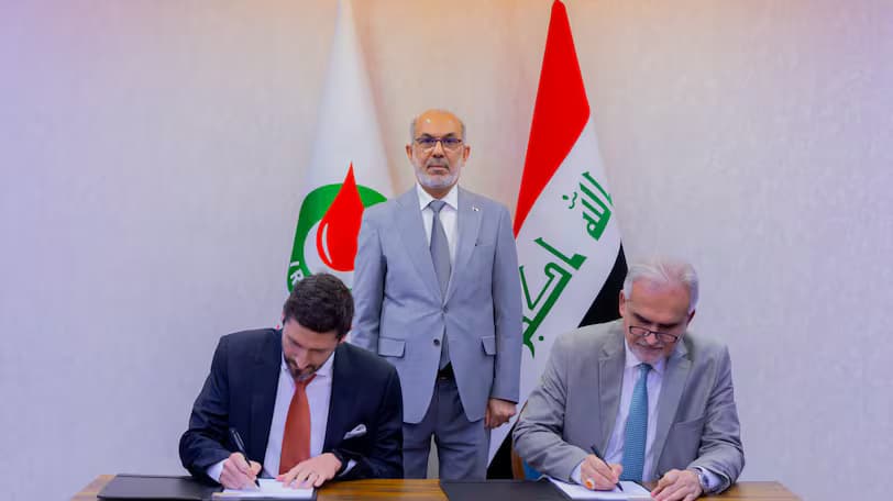 Iraqi oil minister Basim Mohammed Khudair al-Abadi overseeing the signing ceremony of a data pact with Chevron. Photo: Iraqi oil ministry