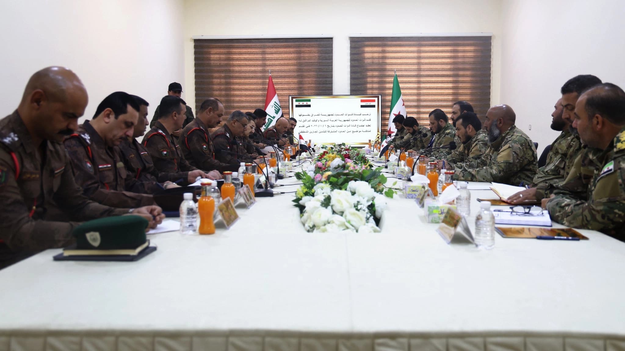 Officials from the Iraqi and Syrian border forces meet in al-Qaim, Iraq's Anbar province, on July 6, 2026. Photo: Syrian Defense Ministry