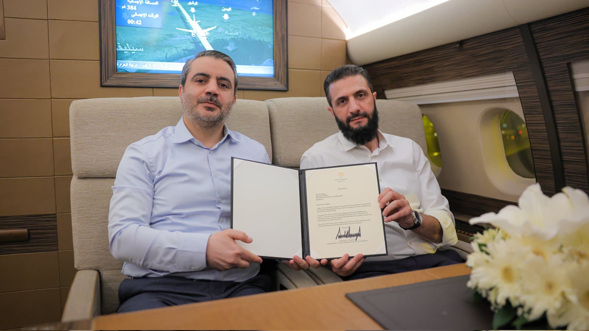 Syrian foreign minister Assad al-Shaibani (left) and Syrian President Ahmed al-Sharaa (righ) holding a signed letter from US President Donald Trump approving the removal of Damascus from state-sponsor of terrorism list. Photo: Shaibani/X