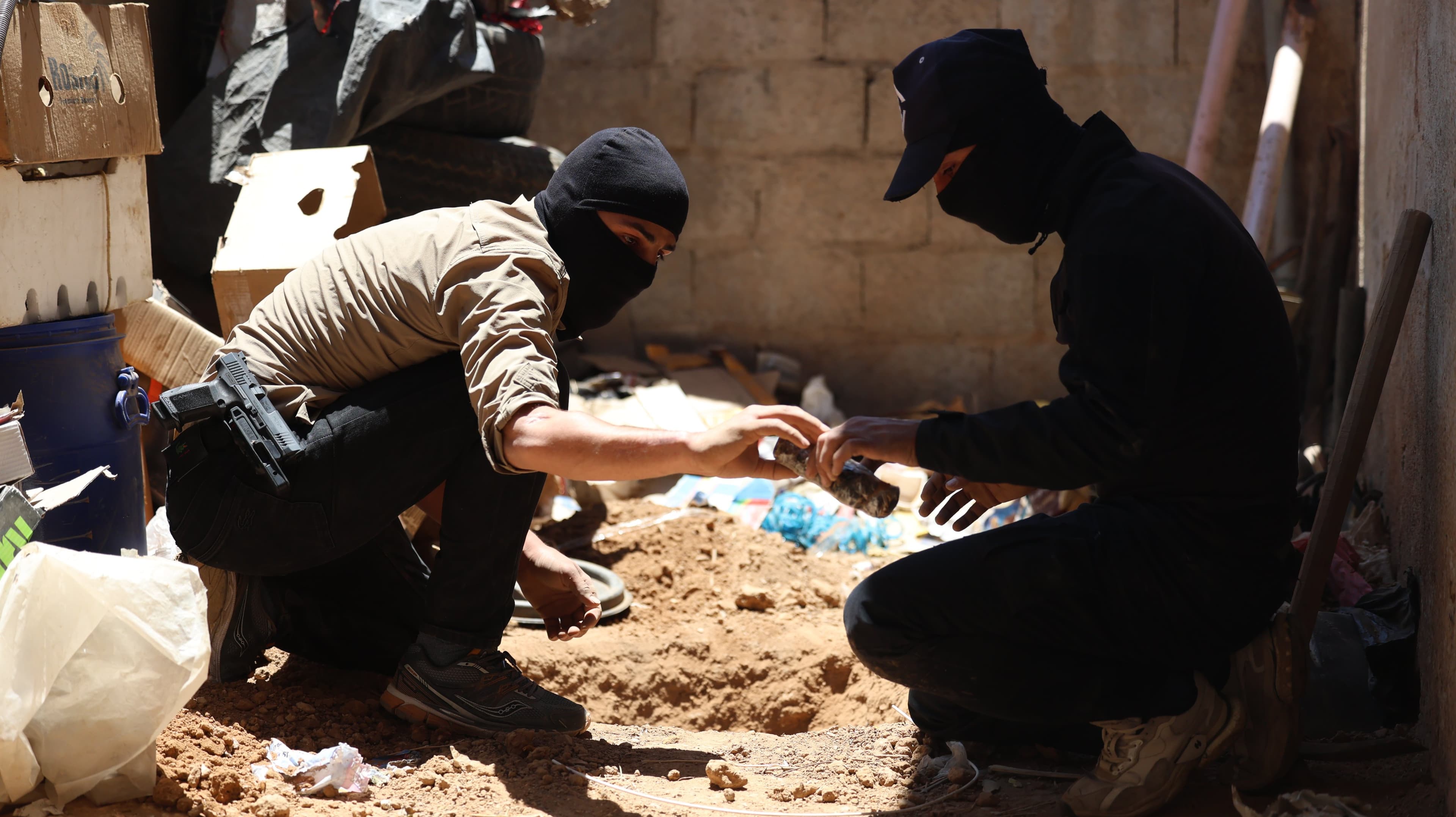 Syrian interior ministry engineering team dismantling and defusing explosives discovered in a secret hideout on July 10, 2026. Photo: Syrian Interior Ministry