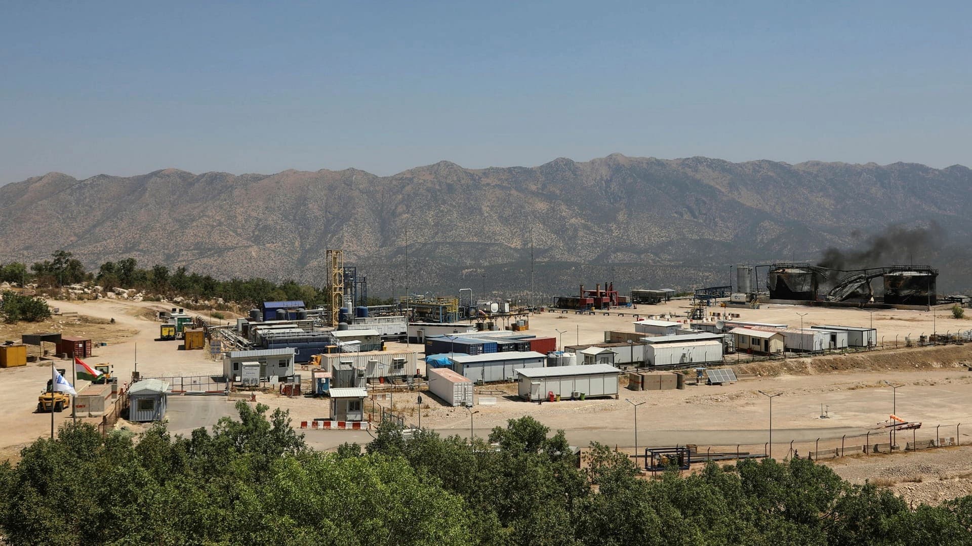Black smoke rises from damaged oil storage tanks following drone attacks on Sarsang oil field in the Kurdish Region, July 17, 2025. File photo: AP