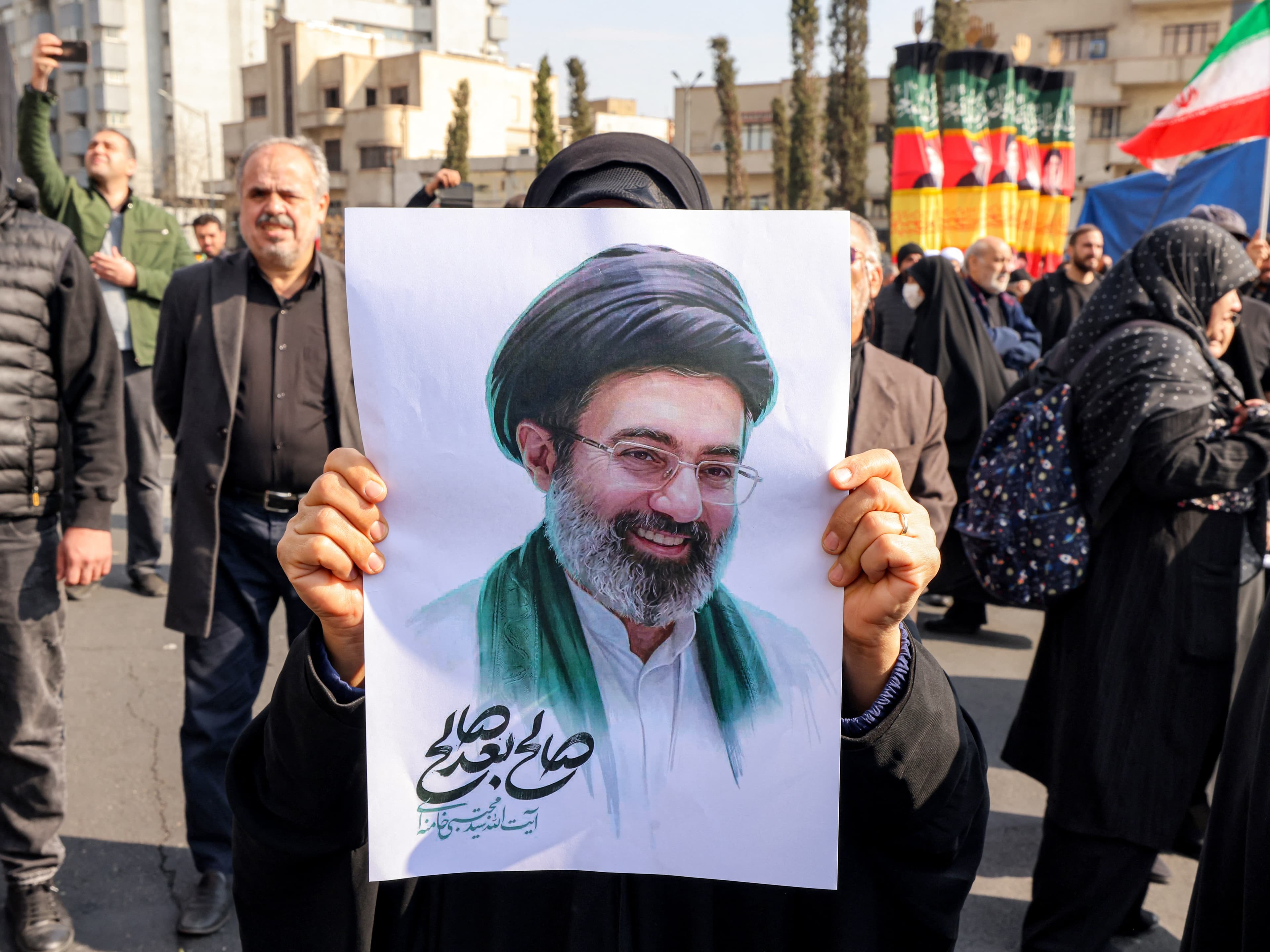 A supporter holding an image of Mojtaba Khamenei in Tehran. Photo: File/AFP