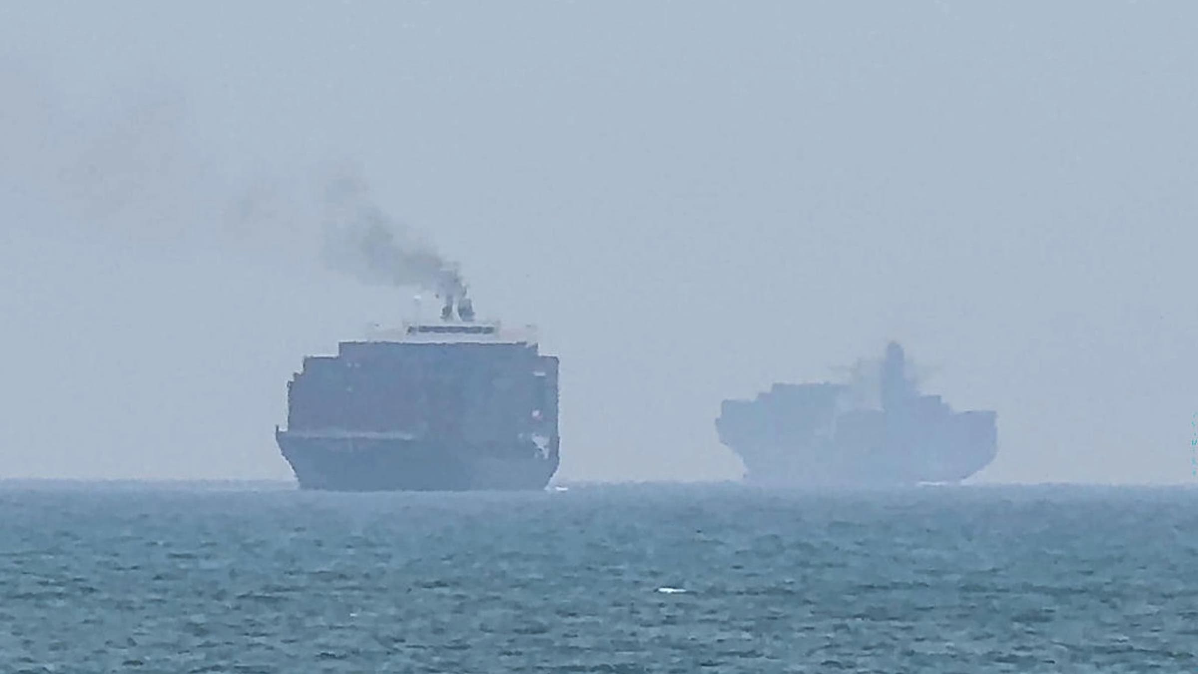 Cargo ships anchoring near the Strait of Hormuz off the eastern coast of the United Arab Emirates at Khor Fakkan, July 12, 2026. File photo: AFP