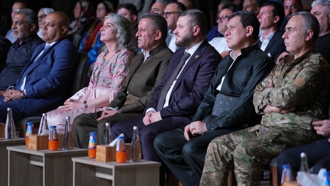 Syrian Democratic Forces (SDF) Chief Mazloum Abdi (second from left) sits alongside Ahmad al-Hilali (third from left), member of the Syrian government team overseeing the SDF integration process, at an event in Qamishli, Hasaka, on August 20, 2026. Photo: MazloumAbdi/X