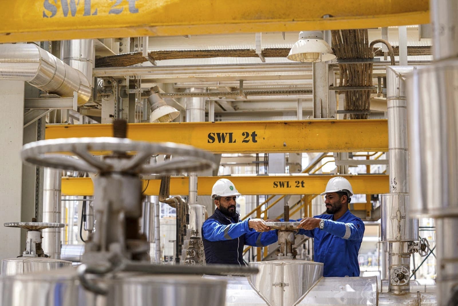 Laborers pictured at southern Iraq's Karbala oil refinery on April 1, 2023. File photo: AFP