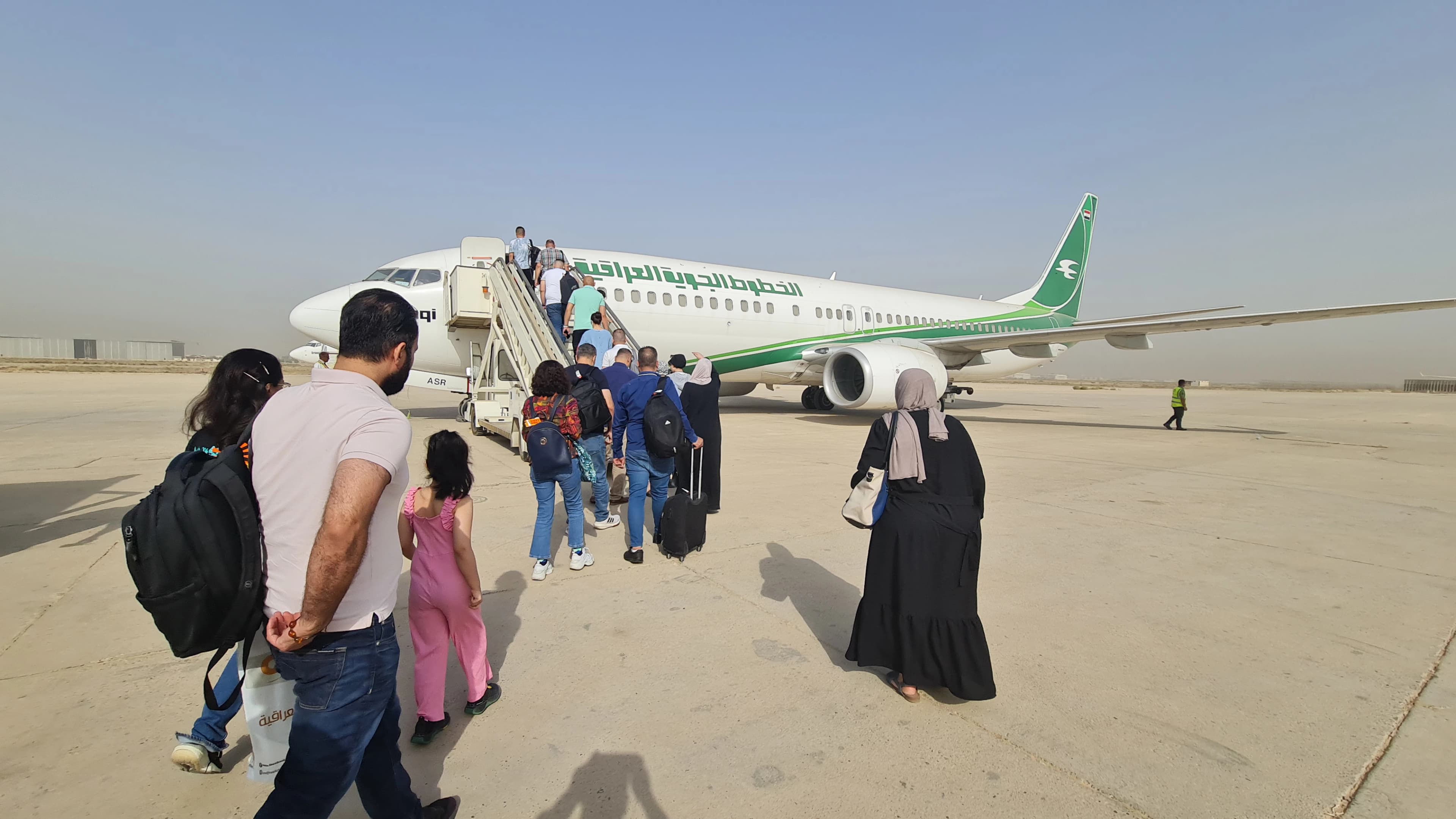 Passengers boarding their flight from Baghdad International Airport via Iraqi Airways on June 6, 2022. Photo: Rudaw