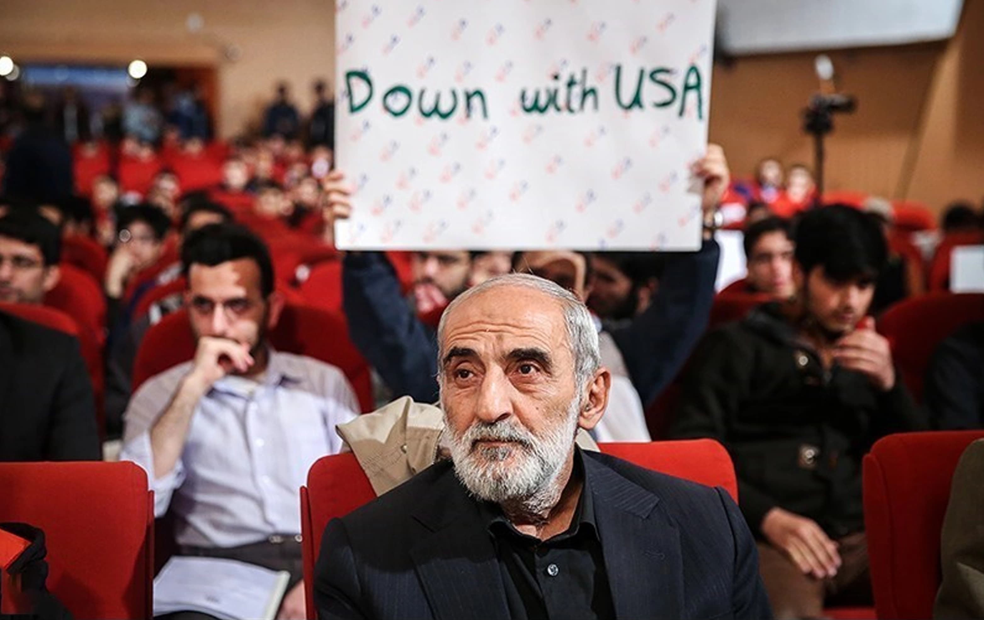 Hossein Shariatmadari sitting among students in a Tehran university, Iran. Photo: Tasnim