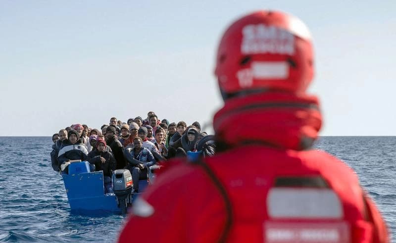 Migrants being taken to a Spanish rescue boat in the Mediterranean international waters off the Libyan coast. Photo: AFP