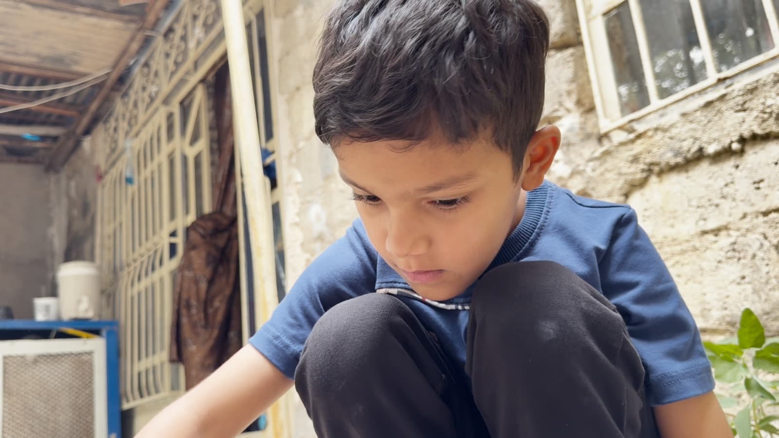 وێنەی یەکێک لە منداڵەکانی قەزای سەیدسادق