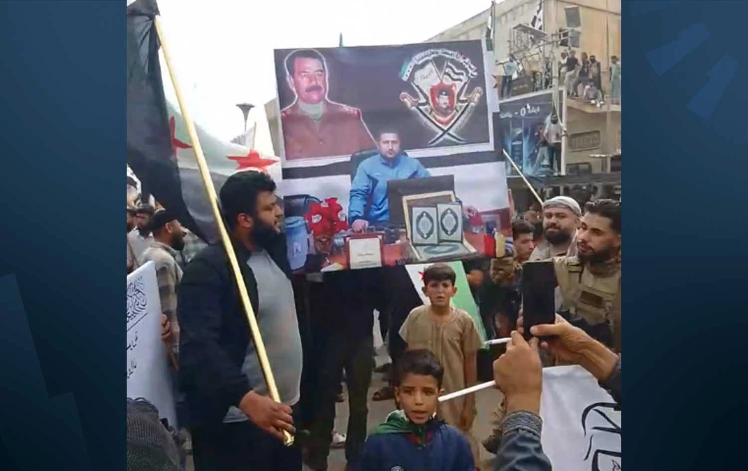 Pro-government Arab demonstrators in Syria’s northeastern city of Hasaka raise a portrait of former Iraqi president Saddam Hussein on October 9, 2026. Photo: Screengrab