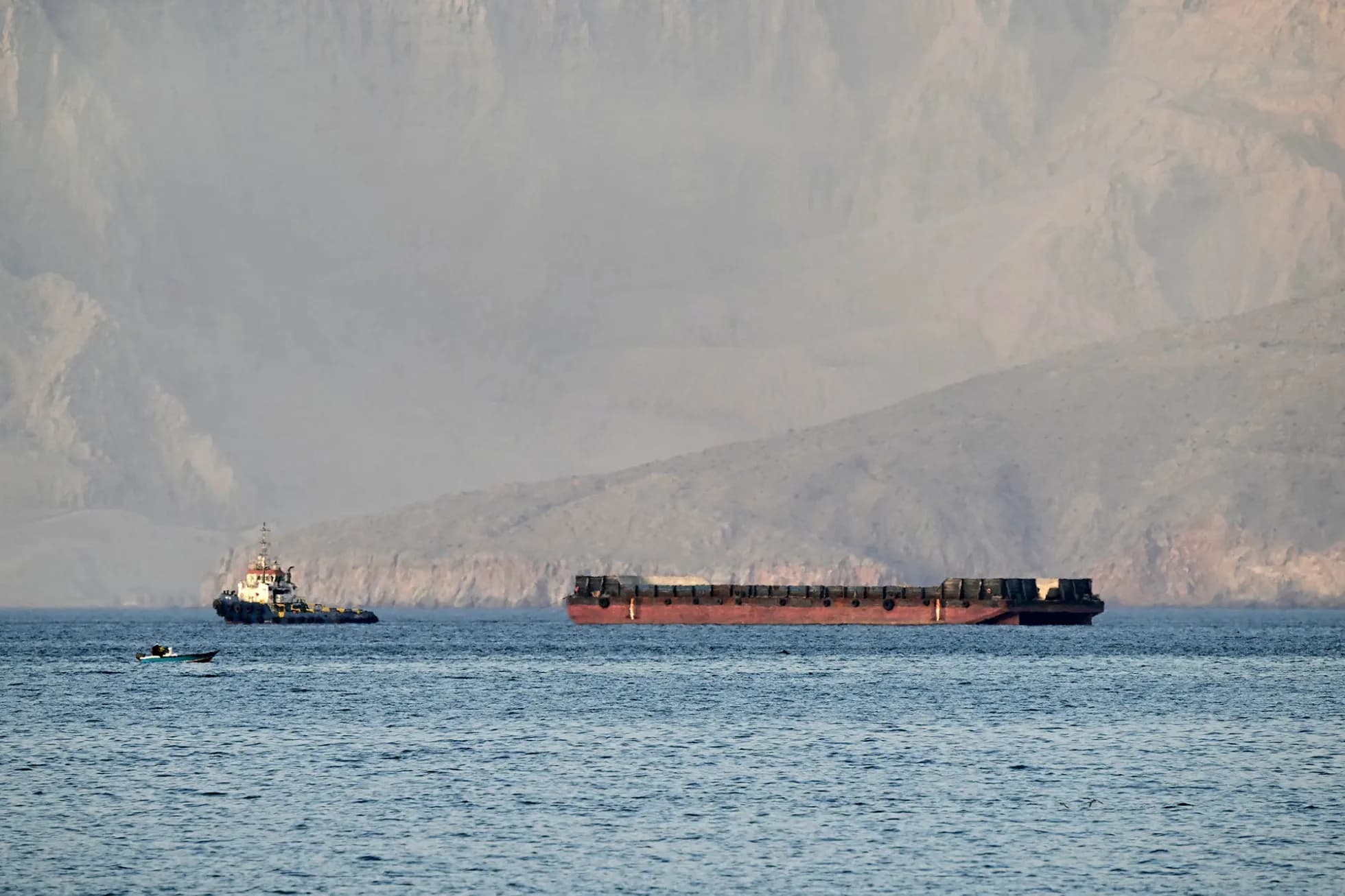 A tug boat towing a ship off the northern Oman's Musandam Peninsula near the Strait of Hormuz. Photo: file/AFP