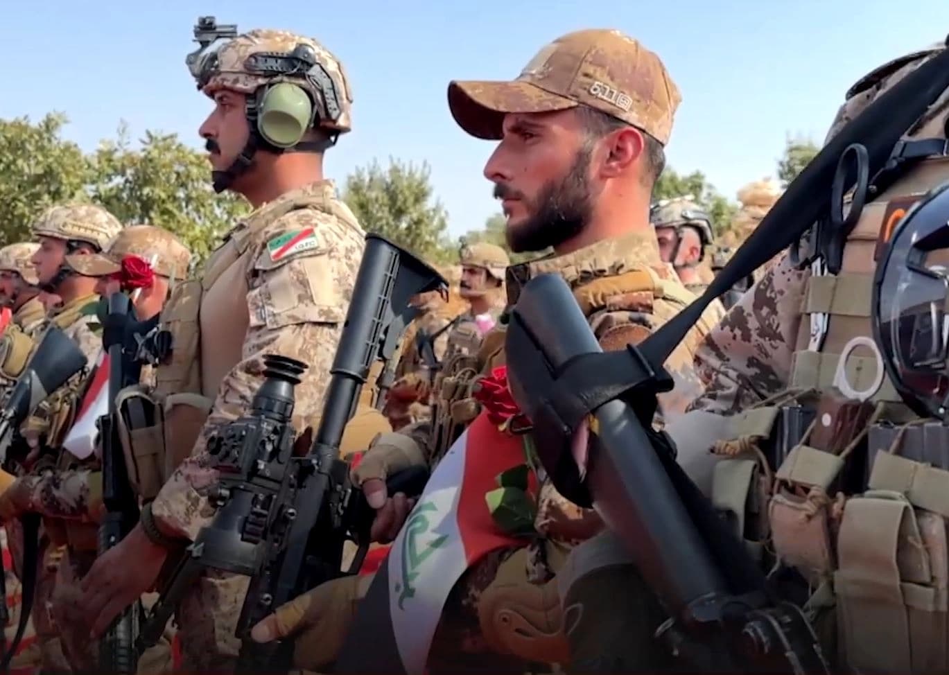 Yazidi fighters and Iraqi armed forces personnel during an integration ceremony in Shingal on October 26, 2026. Photo: Screengrab/Rudaw