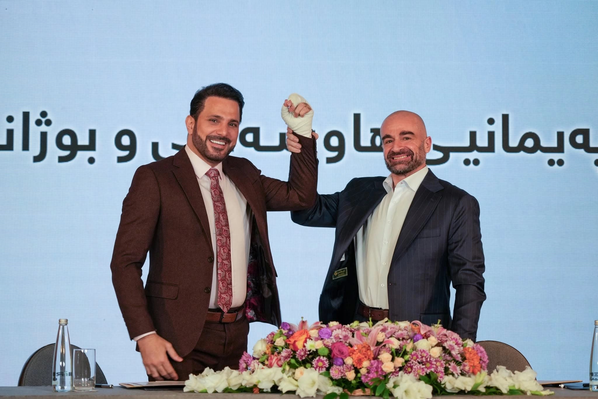 PUK leader Bafel Talabani (right) and New Generation Movement leader Shaswar Abdulwahid during a ceremony in Sulaimani on July 2, 2026 during which they signed an alliance agreement.