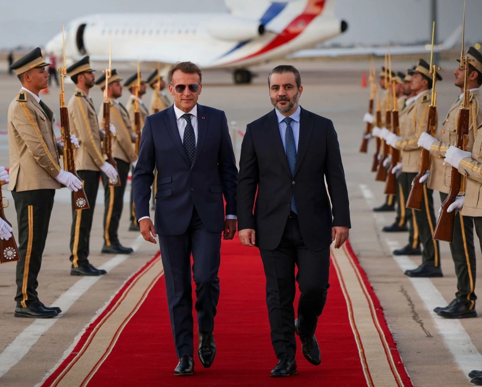 French President Emmanuel Macron (Left) is welcomed by Syria's Foreign Minister Asaad al-Shaibani (Right) as he arrives for a state visit at the Damascus International Airport on July 6, 2026. Photo: SANA