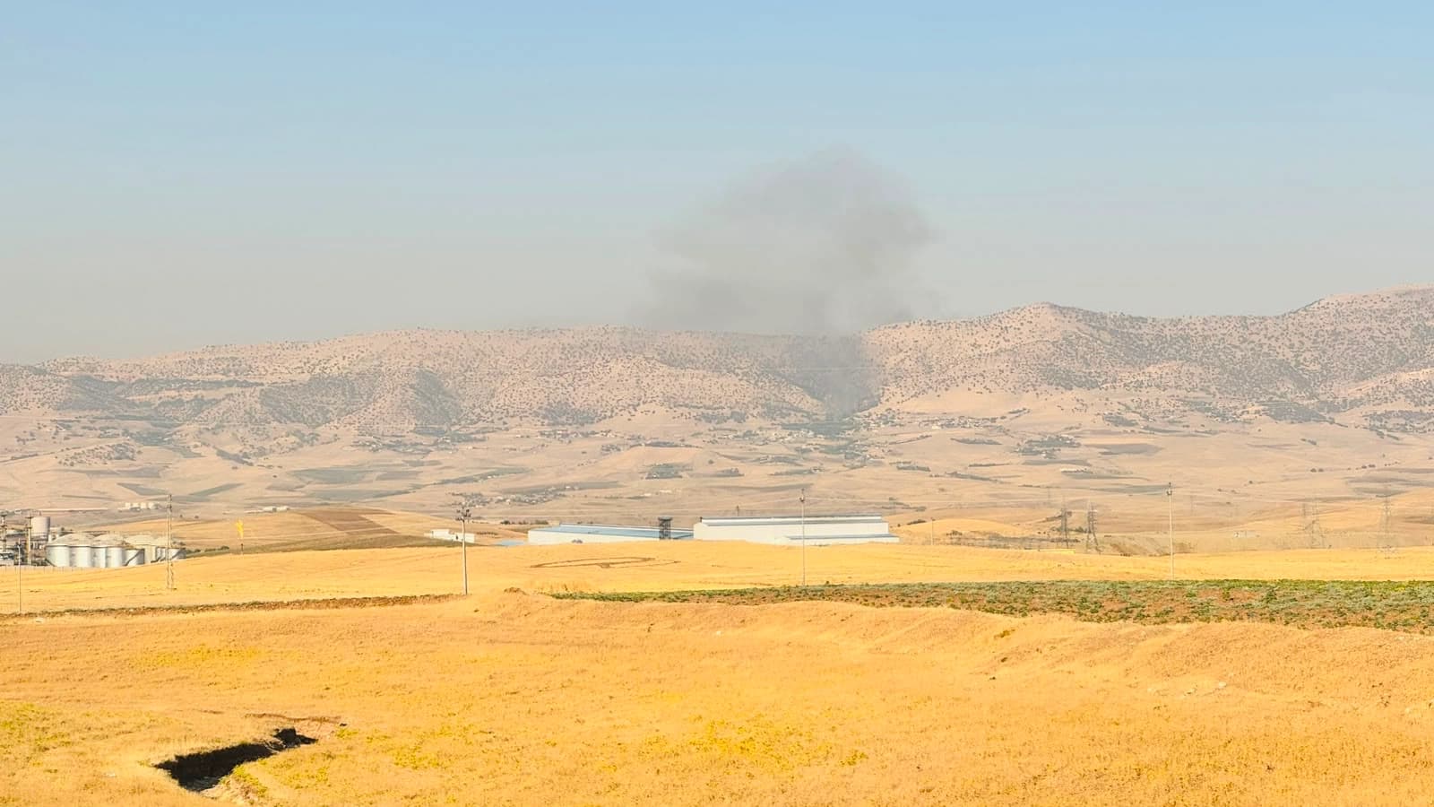 Smoke rises from the town of Zirgwez, located in the southern part of the Kurdistan Region's eastern Sulaimani province, near camps belonging to Iranian Kurdish opposition parties. Photo: Rudaw