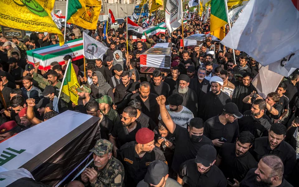 Mourners carry the bodies of Popular Mobilization Forces (PMF) members during their funeral in Baghdad on July 29, 2026. The members were killed in US-Saudi strikes. File photo: AFP