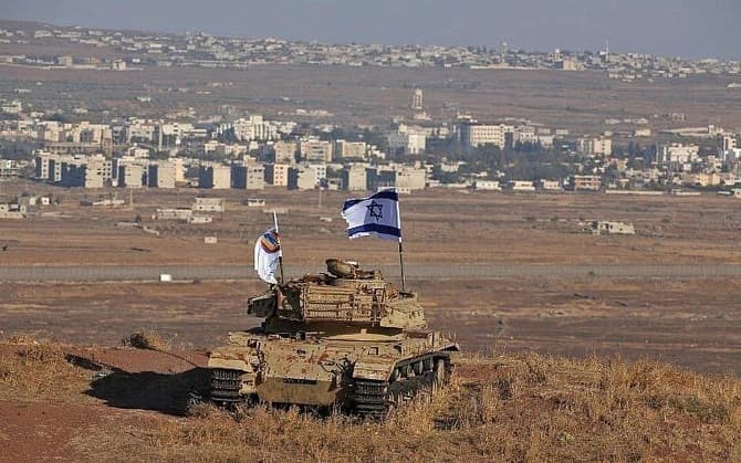 An Israeli main battle tank stationed in the Golan Heights overlooking a Syrian border town. Photo: File/AFP