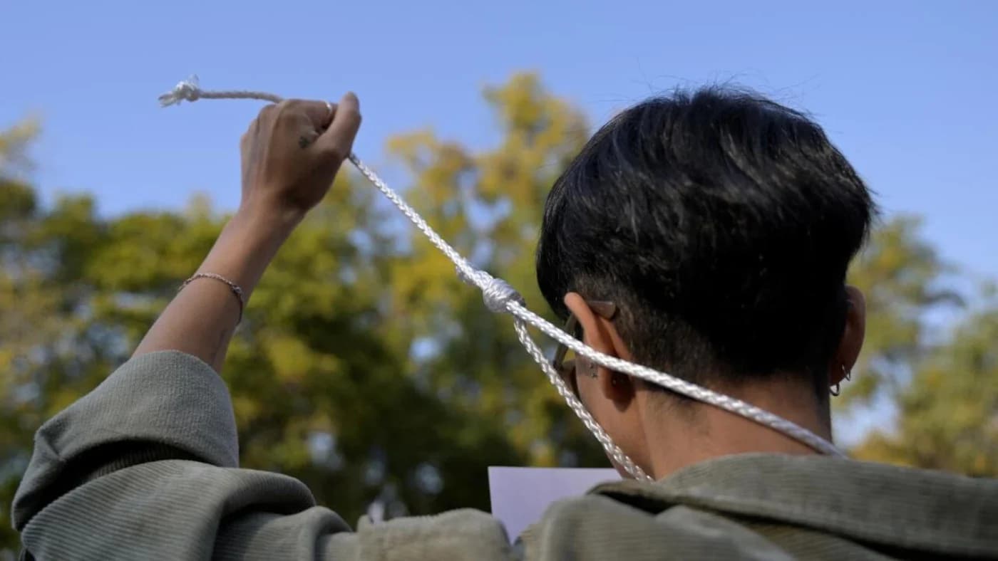 People take part in a protest against the execution of Iranian footballer Amir Nasr-Azadani -sentenced to death within protests following the death of Mahsa Amini- and to demand human rights in Iran, in front of the Iranian embassy in Mexico City on December 19, 2022. Photo: AFP