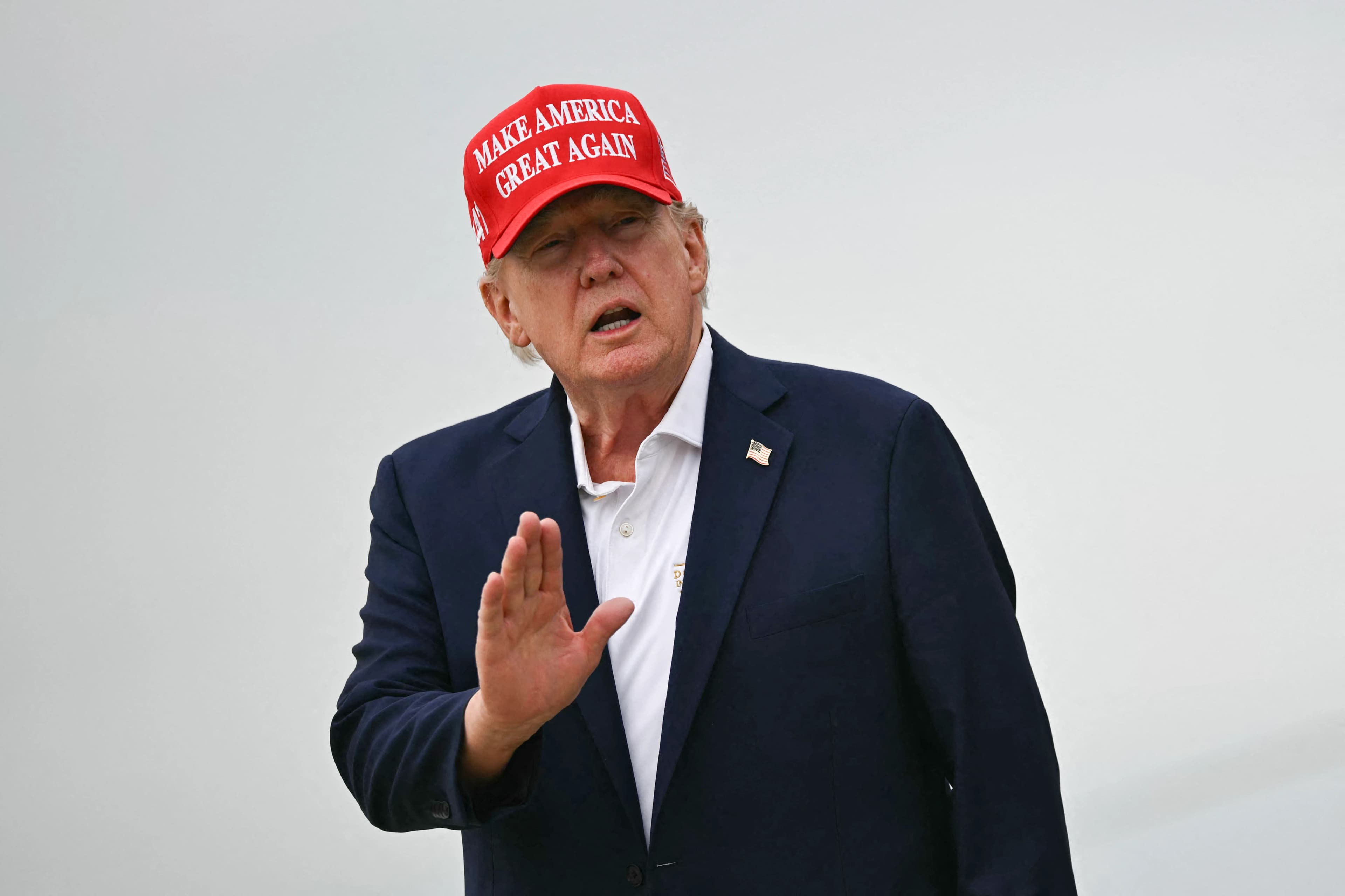 US President Donald Trump gestures as he steps off Air Force One upon arrival at Joint Base Andrews in Maryland on August 16, 2026. Photo: AFP