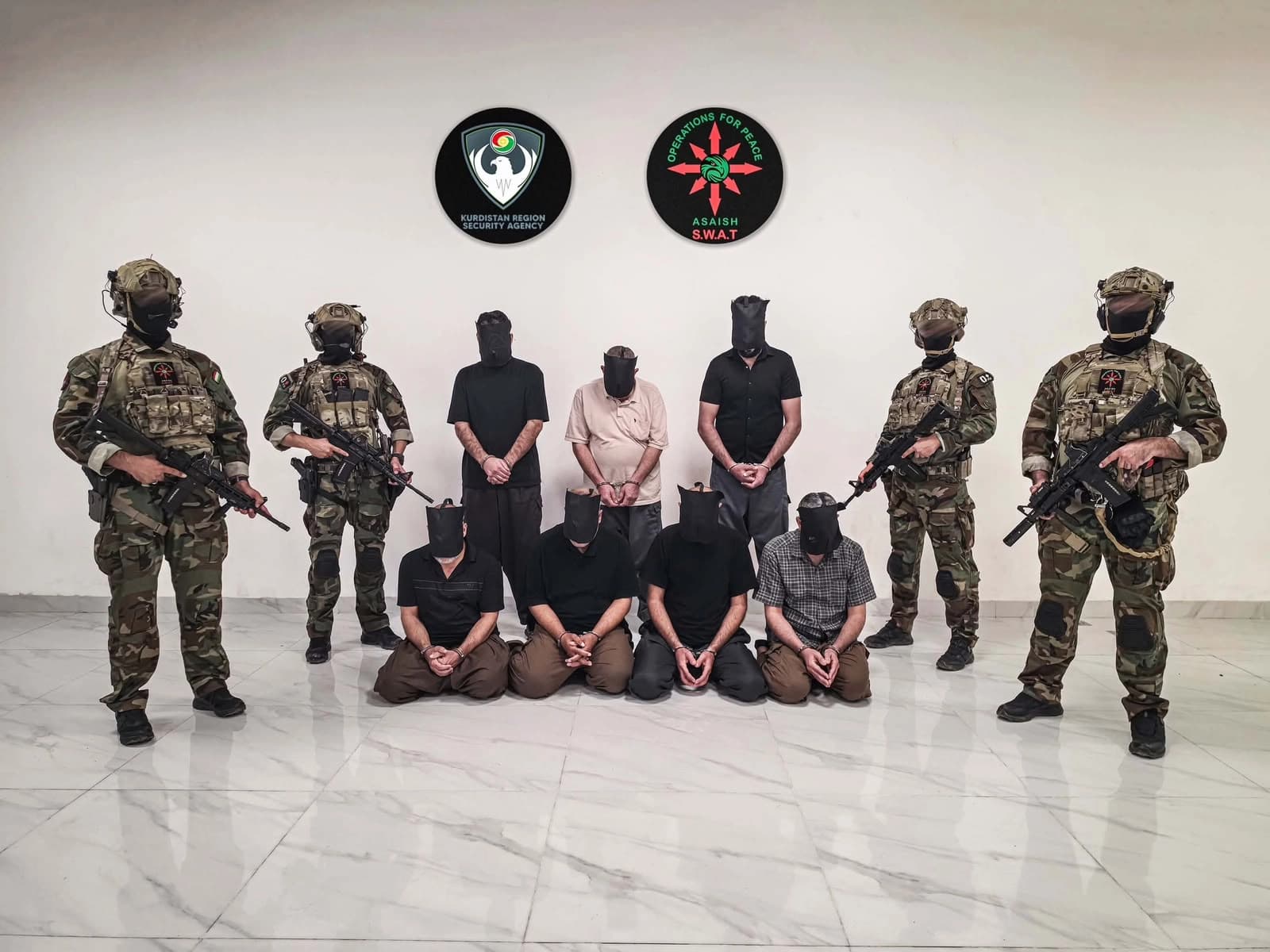 Asayish showing seven arrested ISIS members in Sulaimani on August 18, 2026. Photo: Asayish