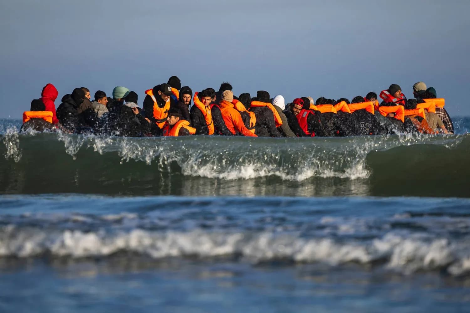 Migrants sit in a sumgglers' boat. Photo: AFP