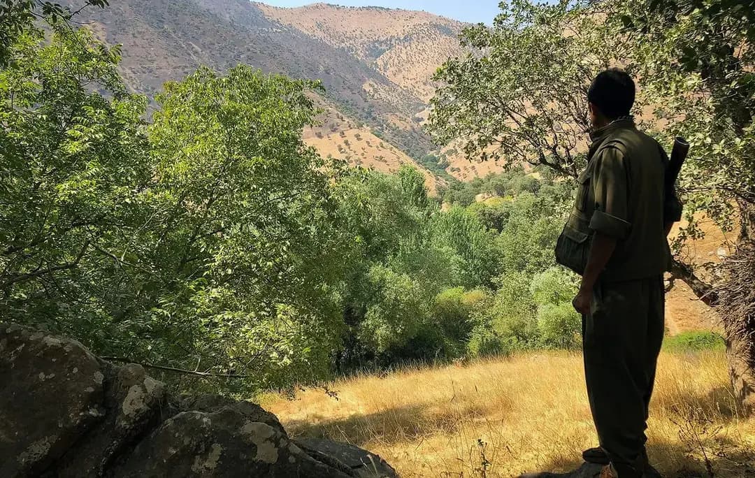 A PJAK fighter looks out over the mountains of Sulaimani province in the summer of 2018. File photo: Fazel Hawramy / Rudaw
