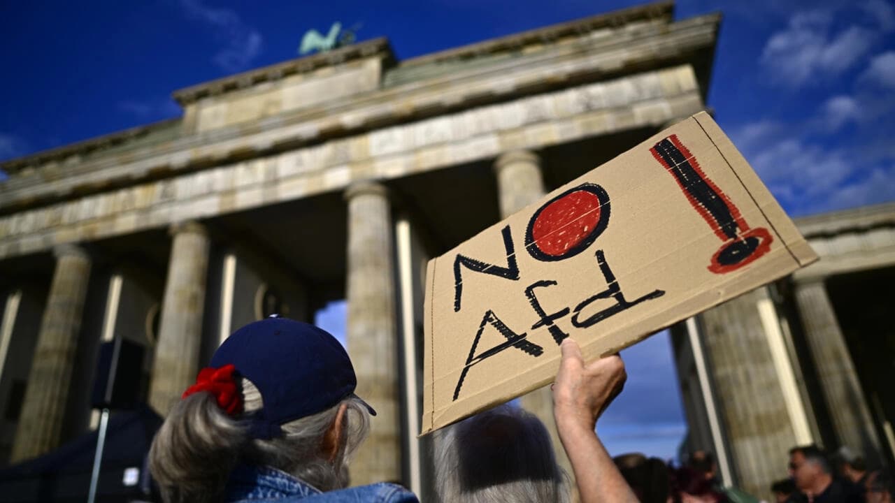 A protester with a sign saying 'No AfD' in Berlin on September 7, 2026. Photo: AFP